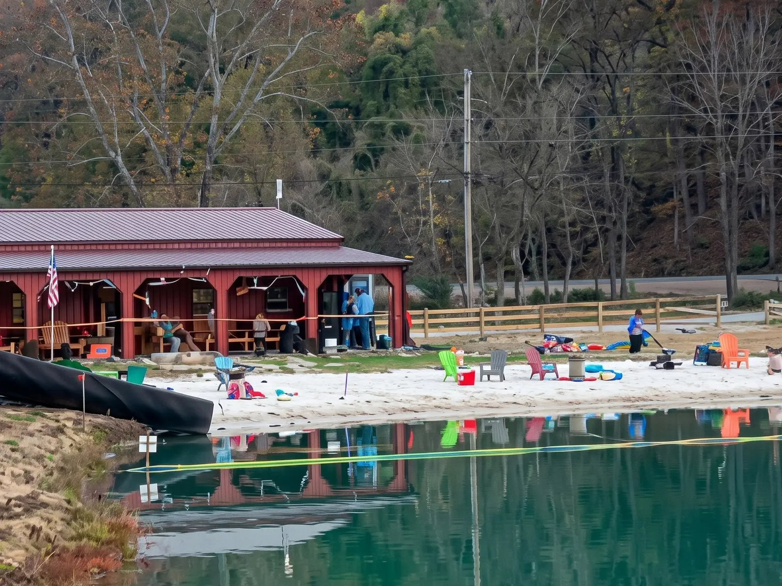 Family swimming with inflatables in the 5-acre swimming lake at Mammoth Ridge